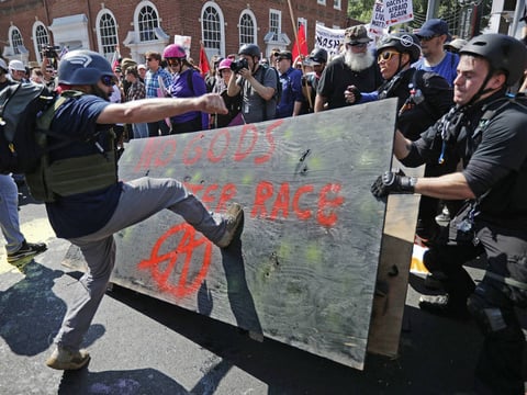 White nationalists, neo-Nazis and members of the "alt-right" clash with counterprotesters as they enter Lee Park during the "Unite the Right" rally Aug. 12 in Charlottesville, Va..


